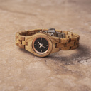 The Lily watch from the FLORA Collection consists of olive wood that has been hand-crafted to its finest slenderness. The Lily dial is made of a black coloured stainless-steel that has a shiny touch and rosegold coloured details.