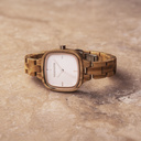 A source of inspiration for each creative artist. The CITY Muse features a square case with a white dial and rose gold details. The watch band consists of soft olive wood that has been hand-finished to perfection and to create our latest small-band design