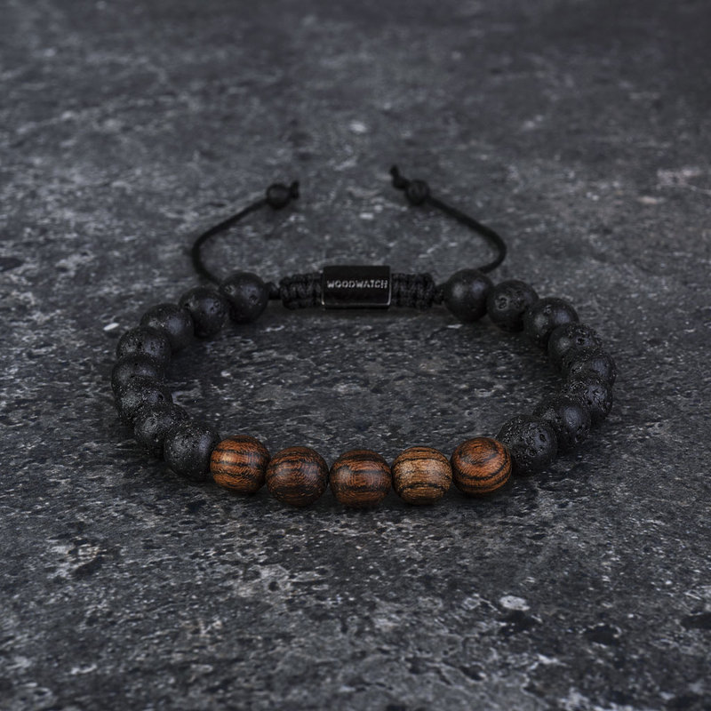 Our handmade Rosewood Volcanic Beads Bracelet features a combination of 8mm Rosewood and Volcanic beads. This bracelet is adjustable and fits most wrist sizes. The perfect accessory to go with any WoodWatch.