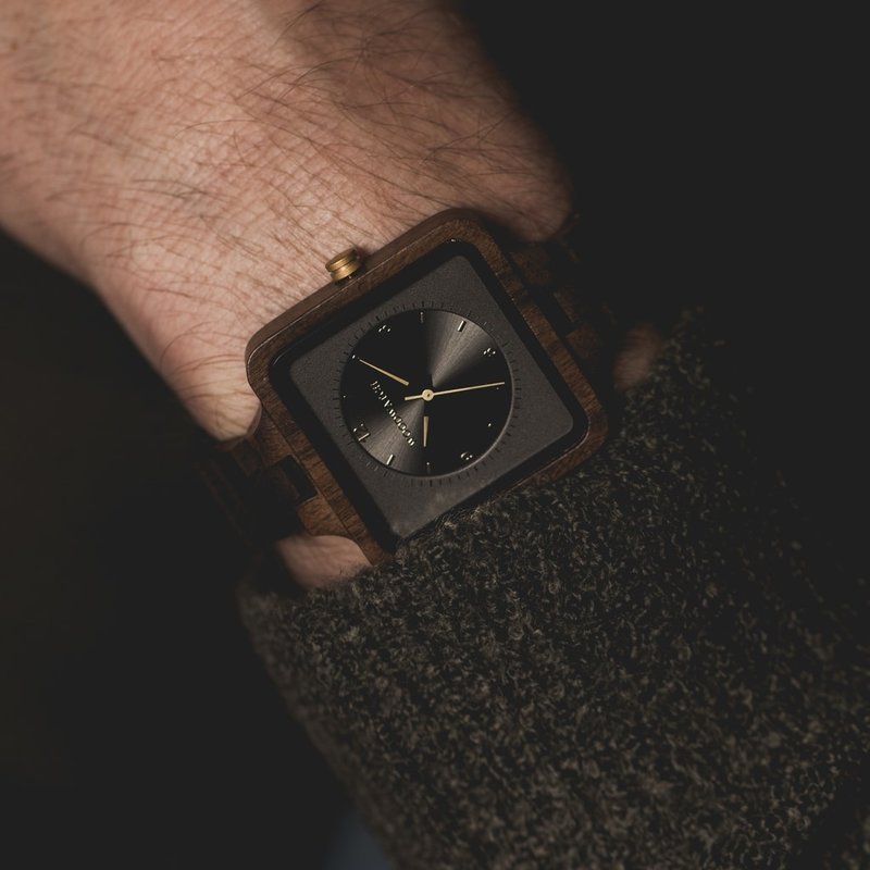 The Dark Origin from the SQUARE Collection features an exclusive 36mm square case combined with a space grey double layered dual dial. This uniquely designed watch consists of natural Black Sandalwood from East Africa with golden details and is handcrafte