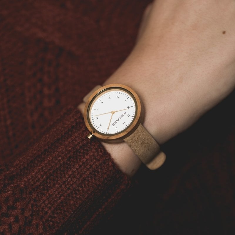 Inspired by contemporary Nordic minimalism. The NORDIC Copenhagen features a 36mm diameter white olive wood case with a white dial and gold details. Handmade from sustainably sourced wood and combined with an ultra soft beige sustainable vegan leather str