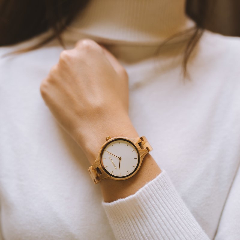 The AURORA Collection breaths the fresh air of Scandinavian nature and the astonishing views of the sky. This light weighing watch is made of European Olive Wood, accompanied by a light stainless-steel dial with a golden highlight and shining golden detai