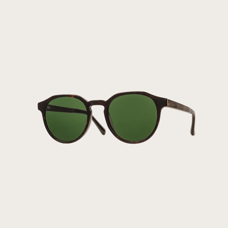 The REVELER Forever Havanas Camo features a sleek geometric dark brown tortoise frame with green camo lenses. Composed of durable Italian Mazzucchelli bio-acetate with hand-finished natural ebony temples and tortoise acetate tips. Bio-acetate is made from