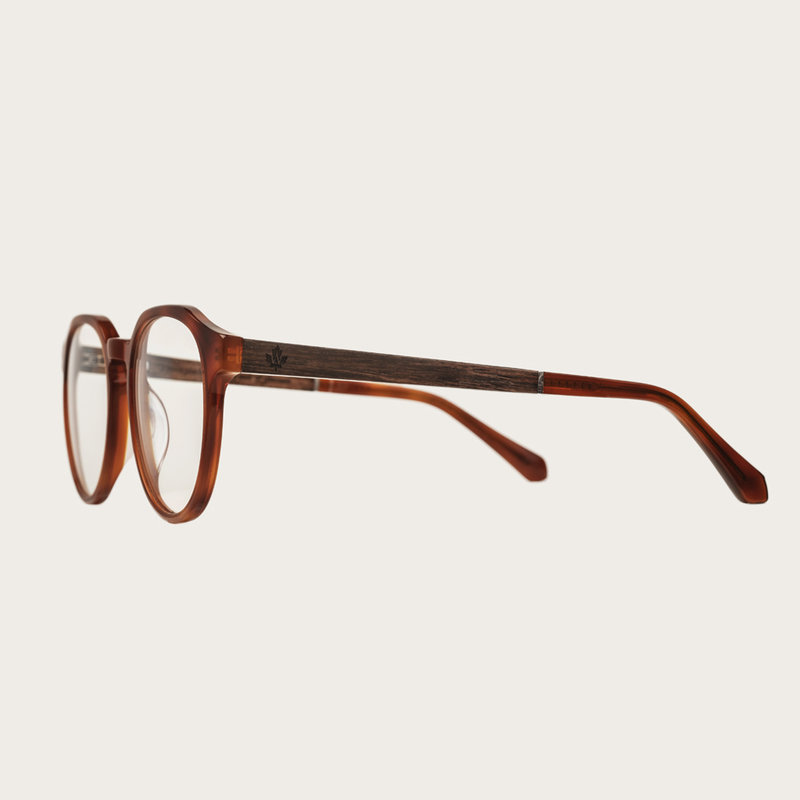 Filter out harmful excess blue light which can cause eye strain, headaches and poor sleep. The Reveler "Classic Havanas" features a sleek geometric dark yellow tortoise frame and is composed of durable Italian Mazzucchelli bio-acetate with hand-finished n