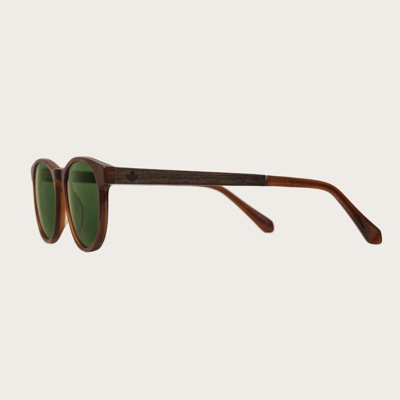 The ELLIPSE Classic Havanas Camo features a characteristic rounded dark yellow tortoise frame with green camo lenses. Composed of durable Italian Mazzucchelli bio-acetate with hand-finished natural ebony temples and tortoise acetate tips. Bio-acetate is m