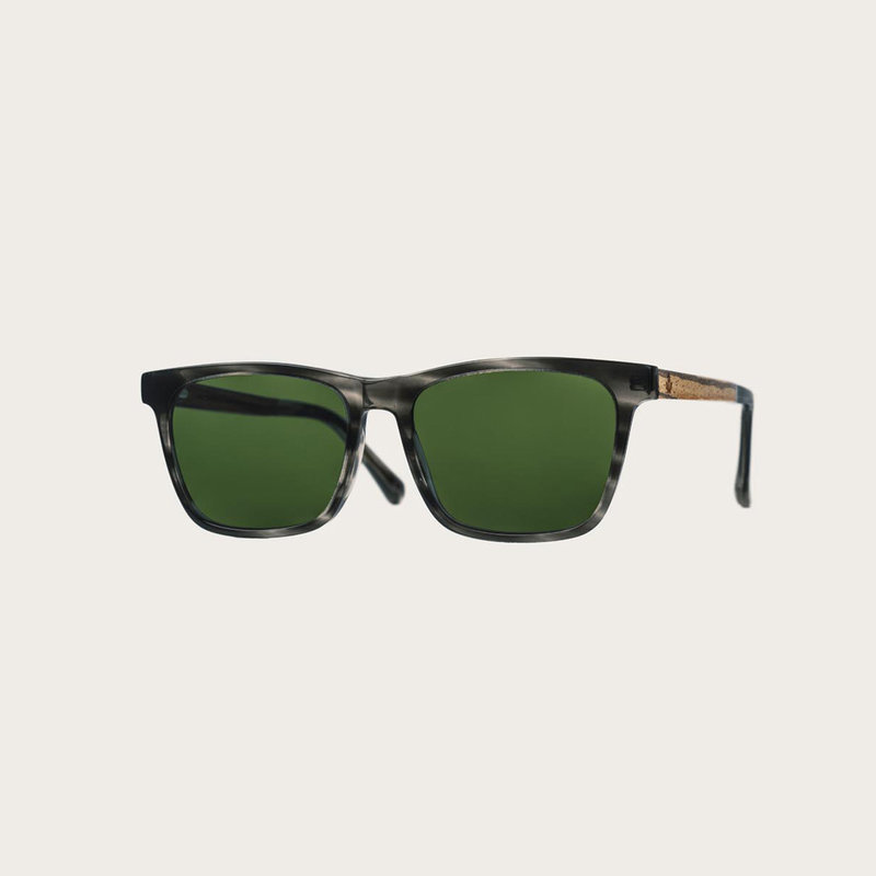 The BROOKLYN Heritage Camo features a squared grey tortoise frame with green camo lenses. Composed of durable Italian Mazzucchelli bio-acetate with hand-finished natural zebrawood temples and tortoise acetate tips. Bio-acetate is made from cotton and orga