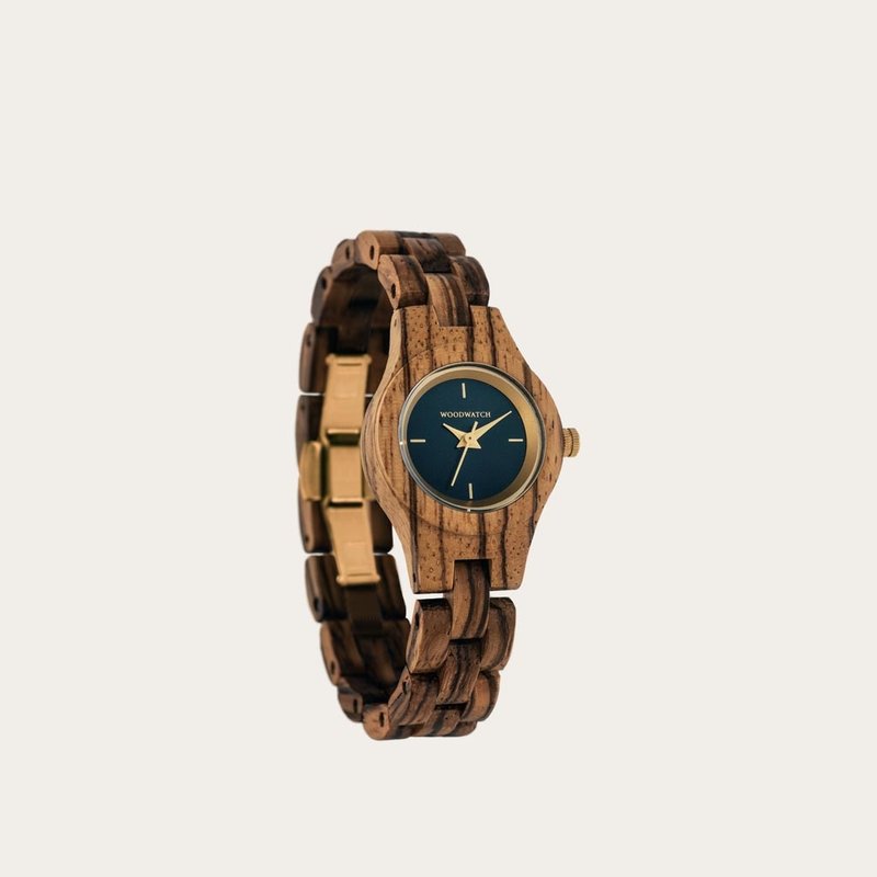 The Juniper watch from the FLORA Collection consists of Zebra wood that has been hand-crafted to its finest slenderness. The Juniper features a dark navy blue dial with golden coloured details.