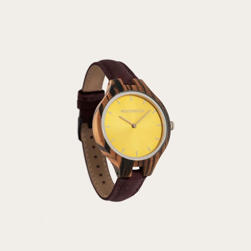 The AURORA Collection breaths the fresh air of Scandinavian nature and the astonishing views of the sky. This light weighing watch is made of East African zebra wood, accompanied by a yellow stainless-steel dial with shining rose gold details.The watch is
