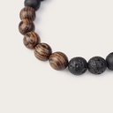 Our handmade Rosewood Volcanic Beads Bracelet features a combination of 8mm Rosewood and Volcanic beads. This bracelet is adjustable and fits most wrist sizes. The perfect accessory to go with any WoodWatch.