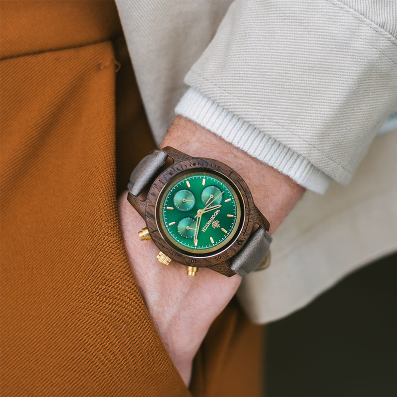 Emerald Gold Grey features a classic SEIKO VD54 chronograph movement, scratch resistant sapphire coated glass and Grey strap. Made from American Walnut Wood and handcrafted to perfection. The watch is available with a wooden strap or a leather strap.