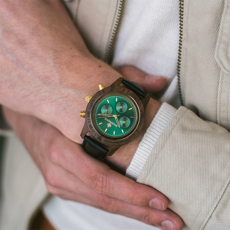 Emerald Gold Jet features a classic SEIKO VD54 chronograph movement, scratch resistant sapphire coated glass and jet strap. Made from American Walnut Wood and handcrafted to perfection. The watch is available with a wooden strap or a leather strap.