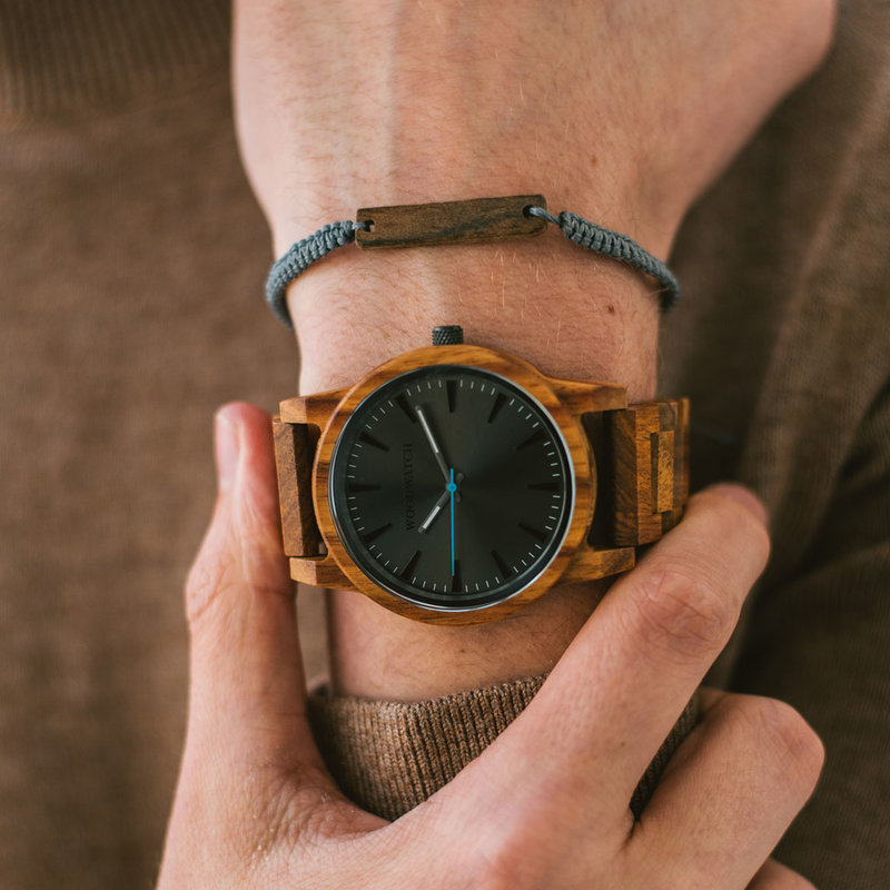 The Reveler Kosso features a modernized minimal grey dial with bold details in a 45mm case. A wrist essential combining natural wood with stainless steel and sapphire coated glass. The Reveler Kosso is handmade from natural Kosso wood from East Africa.