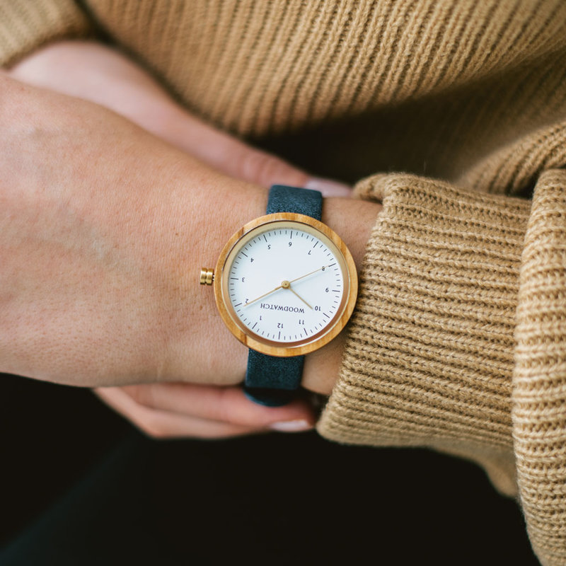 Inspired by contemporary Nordic minimalism. The NORDIC Copenhagen features a 36mm diameter white olive wood case with white dial and gold details. Handmade from sustainably sourced wood and combined with an ultra soft blue sustainable vegan leather strap.