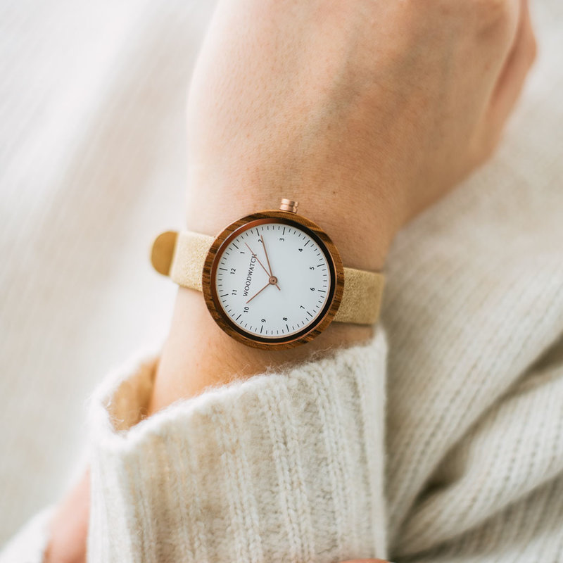 Inspired by contemporary Nordic minimalism. The NORDIC Oslo Beige features a 36mm diameter white zebra wood case with a white dial and rose gold details. Handmade from sustainably sourced wood combined with a beige sustainable vegan leather strap.