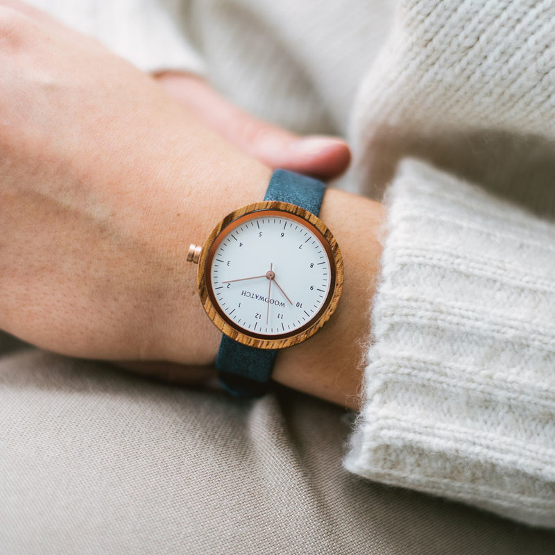 Inspired by contemporary Nordic minimalism. The NORDIC Oslo Navy features a 36mm diameter white zebra wood case with a white dial and rose gold details. Handmade from sustainably sourced wood combined with an ultra soft blue sustainable vegan leather stra