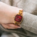 The CITY Vivid features a 30mm square case with a red dial. The watch band consists of natural kosso wood that has been hand-finished to perfection and to create our latest small-band design.