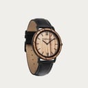 A combination of unique materials with a minimal design to create a timeless look. This modern watch suits both your casual day look and your finest formal wear. A super thin case made of the finest stainless steel with a matte black finish. A statement o