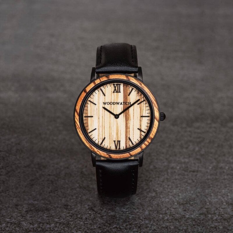 A combination of unique materials with a minimal design to create a timeless look. This modern watch suits both your casual day look and your finest formal wear. A super thin case made of the finest stainless steel with a matte black finish. A statement o