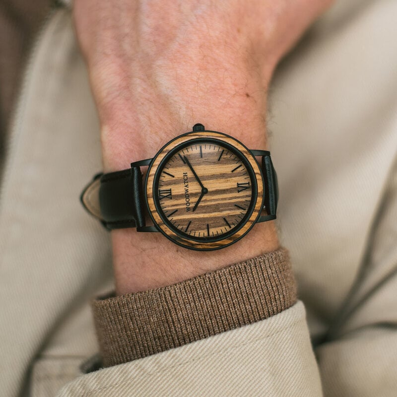 A combination of unique materials with a minimal design to create a timeless look. This modern watch suits both your casual day look and your finest formal wear. A super thin case made of the finest stainless steel with a matte black finish. A statement o