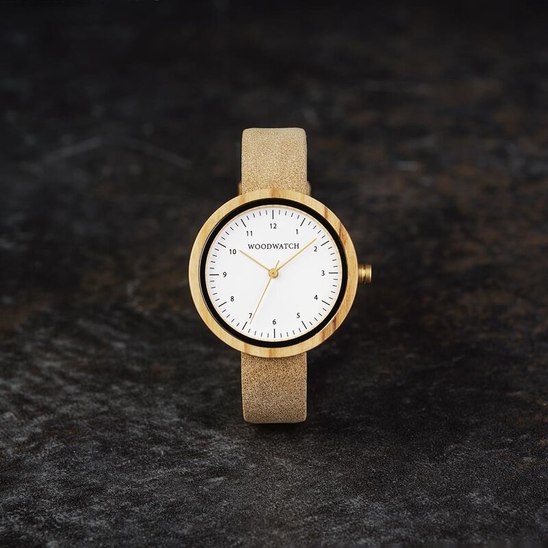 Inspired by contemporary Nordic minimalism. The NORDIC Copenhagen features a 36mm diameter white olive wood case with a white dial and gold details. Handmade from sustainably sourced wood and combined with an ultra soft beige sustainable vegan leather str