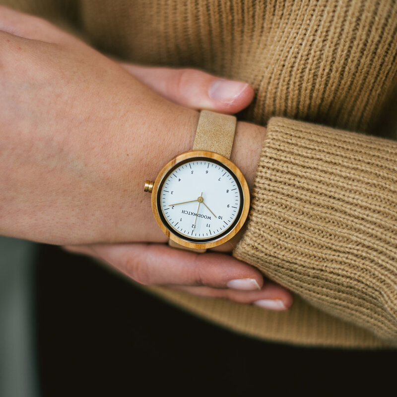 Inspired by contemporary Nordic minimalism. The NORDIC Copenhagen features a 36mm diameter white olive wood case with a white dial and gold details. Handmade from sustainably sourced wood and combined with an ultra soft beige sustainable vegan leather str
