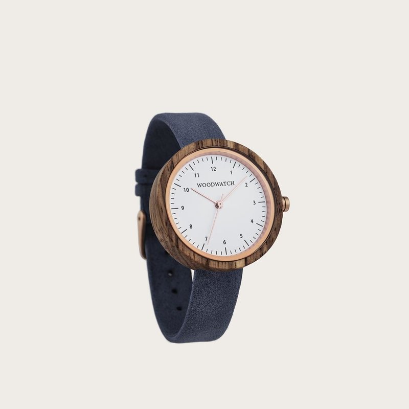 Inspired by contemporary Nordic minimalism. The NORDIC Oslo Navy features a 36mm diameter white zebra wood case with a white dial and rose gold details. Handmade from sustainably sourced wood combined with an ultra soft blue sustainable vegan leather stra