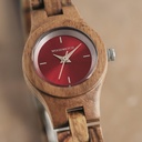 The Poppy watch from the FLORA Collection consists of kosso wood that has been hand-crafted to its finest slenderness. The Poppy features a red dial with silver coloured details.