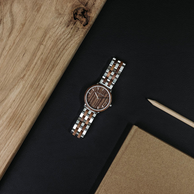 A renewed MINIMAL design with a timeless look that matches any occasion. Featuring a thin, steel case, and walnut bezel and dial. Comes with a new watch strap, designed from the ground up to perfectly match the minimal watch case in style and materials.