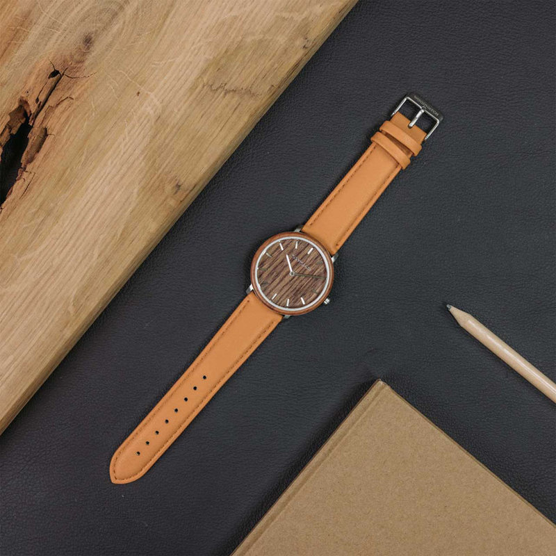 A renewed MINIMAL design with a timeless look that matches any occasion. Featuring a thin, steel case, and walnut bezel and dial. Comes with a new watch strap, designed from the ground up to perfectly match the minimal watch case in style and materials.