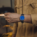 A renewed MINIMAL design with a timeless look that matches any occasion. Featuring a thin, steel case, and walnut bezel and blue dial. Comes with a new watch strap, designed from the ground up to perfectly match the minimal watch case in style and materia