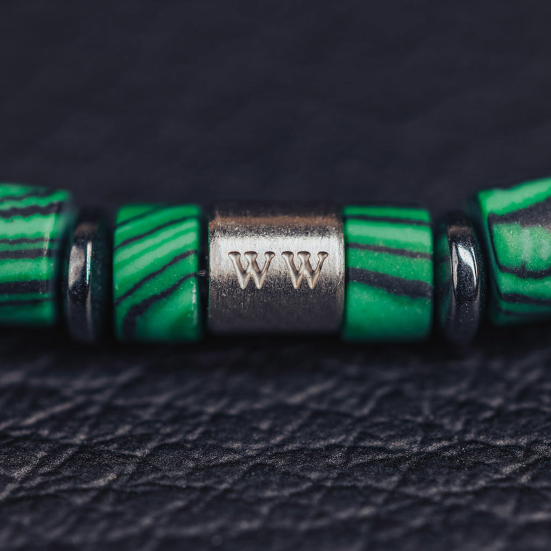 Handmade natural stone bracelet from green malachite. Features 4mm sliced beads and a stainless steel accent. Made with a quality stretch cord to easily put it on and take it off.