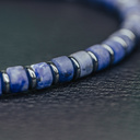 Handmade natural stone bracelet from blue sodalite. Features 4mm sliced beads and a stainless steel accent. Made with a quality stretch cord to easily put it on and take it off.
