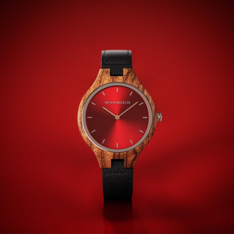 The AURORA Collection breaths the fresh air of Scandinavian nature and the astonishing views of the sky. This light weighing watch is made of kosso wood, accompanied by a red stainless-steel dial.Comes with a cactus leather strap in matching black, extrem