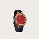 The AURORA Collection breaths the fresh air of Scandinavian nature and the astonishing views of the sky. This light weighing watch is made of kosso wood, accompanied by a red stainless-steel dial. Comes with a cactus leather strap in matching navy blue, e
