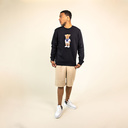 Soft unisex long-sleeved sweater with a round neck. Made of 85% organic cotton and 15% recycled polyester, featuring a full body Harvey print.