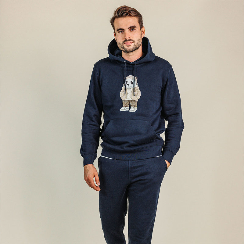 Soft unisex long-sleeved hoodie with a double layered hood and a kangaroo pocket at the front. Made of 85% organic cotton and 15% recycled polyester, featuring a full body Harvey print.