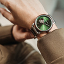 The Open-heart Pure Green is made of Chacate Preto and features a green dial with steel metal details.