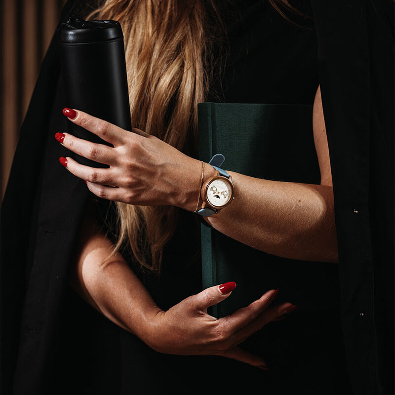 The Selene Azure Frost is crafted from walnut wood, featuring a white dial, light blue vegan strap, and golden details.