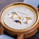 The Selene Azure Frost is crafted from walnut wood, featuring a white dial, light blue vegan strap, and golden details.