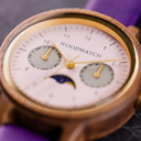 The Selene Raspberry Royale is crafted from walnut wood, featuring a pink dial, violet vegan strap, and golden details.