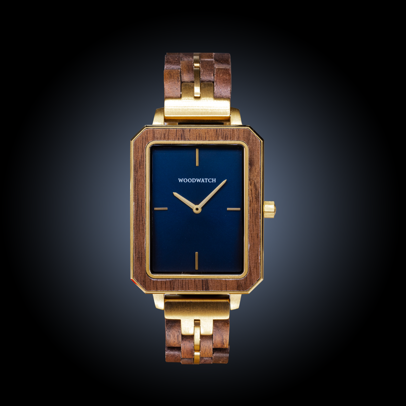 The Elegance Midnight Shade is crafted from walnut wood and stainless steel, featuring a navy blue dial with brushed gold metal details.