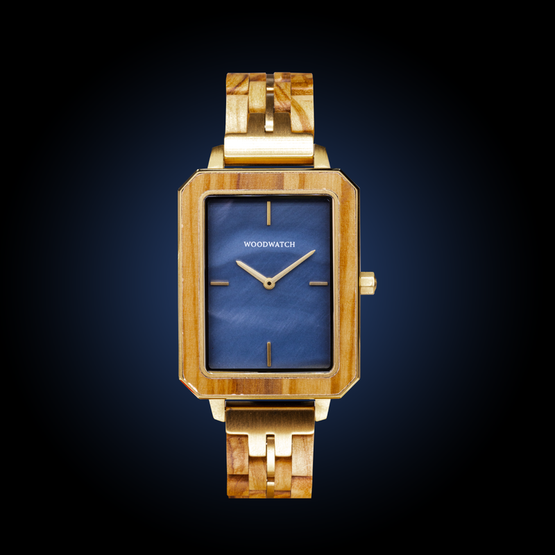 The Elegance Blue Pearl is crafted from olive wood and stainless steel, featuring a blue mother-of-pearl dial with brushed gold metal details.