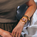 The Radiance Rose Champagne is crafted from olive wood and stainless steel brushed gold, featuring a light pink dial and brushed gold metal details.