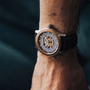 The Nostalgia Espresso is crafted from walnut wood and stainless steel, featuring a matte blue dial, dark brown vegan leather strap, and brushed silver metal details.
