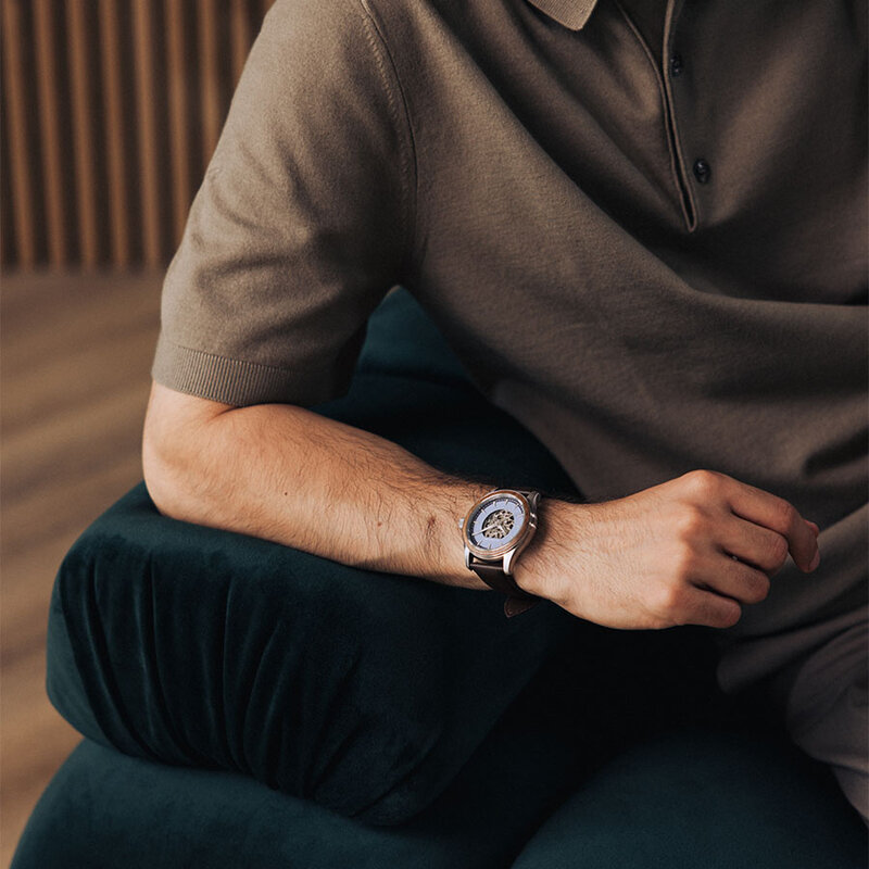 The Nostalgia Espresso is crafted from walnut wood and stainless steel, featuring a matte blue dial, dark brown vegan leather strap, and brushed silver metal details.