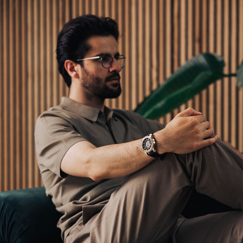 The Nostalgia Jet is crafted from walnut wood and stainless steel, featuring a matte black dial, black vegan leather strap, and brushed silver metal details.