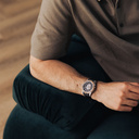 The Nostalgia Jet is crafted from walnut wood and stainless steel, featuring a matte black dial, black vegan leather strap, and brushed silver metal details.