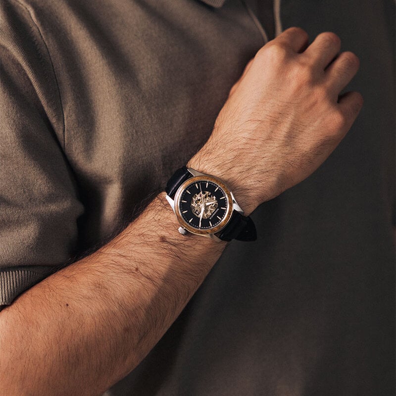 The Nostalgia Jet is crafted from walnut wood and stainless steel, featuring a matte black dial, black vegan leather strap, and brushed silver metal details.