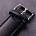The Nostalgia Jet is crafted from walnut wood and stainless steel, featuring a matte black dial, black vegan leather strap, and brushed silver metal details.