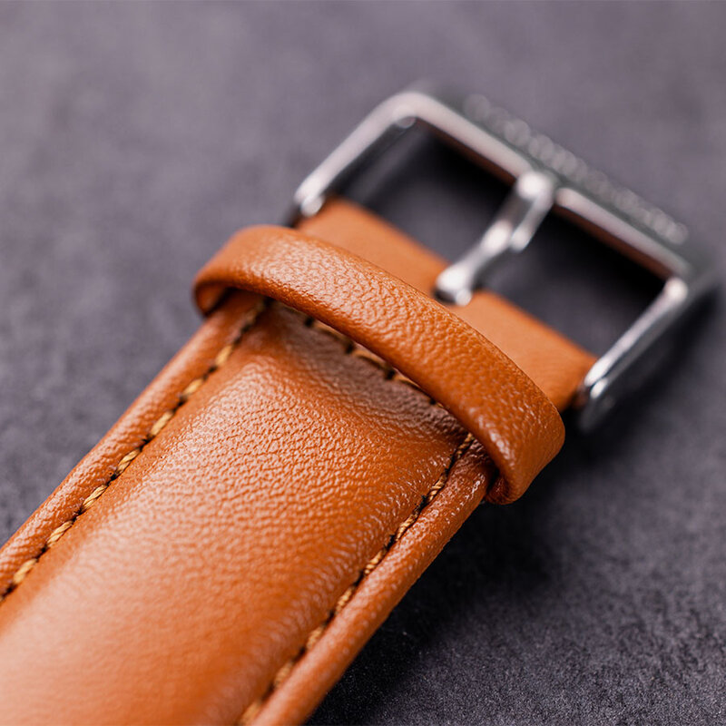 The Nostalgia Desert is crafted from walnut wood and stainless steel, featuring a beige dial, light brown vegan leather strap, and brushed silver metal details.